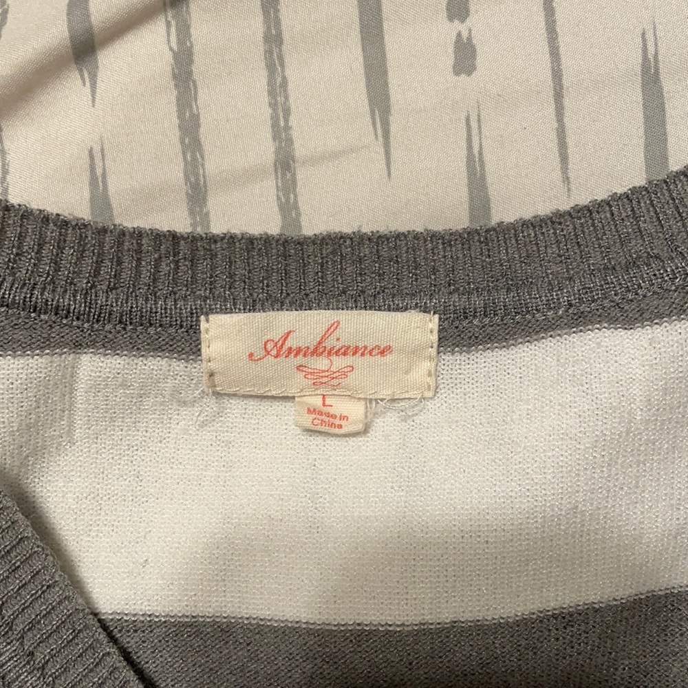 Grey and White long sleeve sweater, says Large but runs small